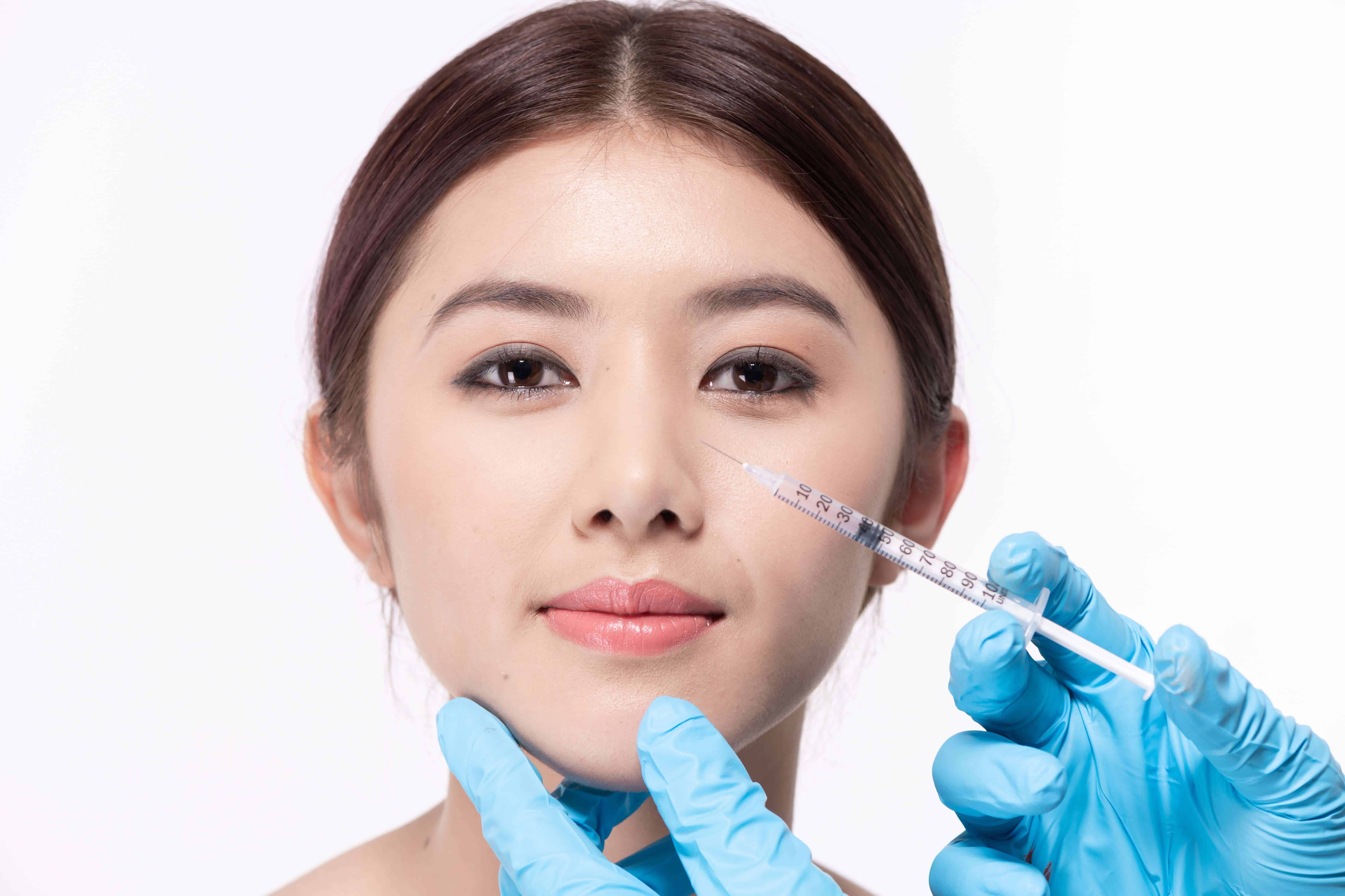 an asian girl going through botox treatment to reduce anti wrinkle